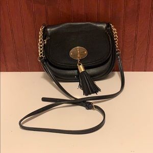 Black cross body with tassel and gold accents